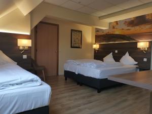 Postel nebo postele na pokoji v ubytování Hotel Albert II Oostende