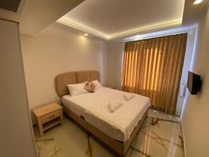 Ένα ή περισσότερα κρεβάτια σε δωμάτιο στο Huma Elite Hotel +64 φωτογραφίες