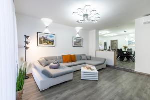 a living room with a couch and a table at Reset Apartments in Kranjska Gora