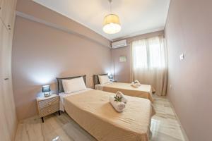 Ένα ή περισσότερα κρεβάτια σε δωμάτιο στο Lydia's Apartments