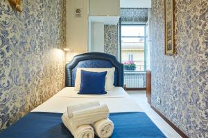 Łóżko lub łóżka w pokoju w obiekcie Fabrizio's Rooms