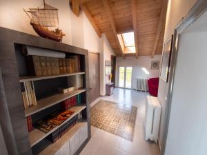 a hallway with a book shelf in a house at VILLA SILVIA-by Home Sitter Como in Como