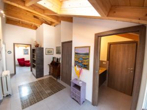 a living room with a wooden ceiling and a door at VILLA SILVIA-by Home Sitter Como in Como