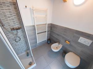 a bathroom with a shower and a toilet and a sink at VILLA SILVIA-by Home Sitter Como in Como