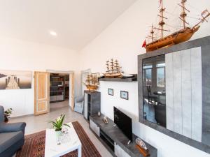 a living room with a couch and a tv at VILLA SILVIA-by Home Sitter Como in Como
