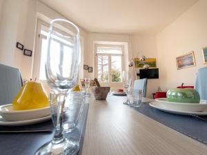 a dining room table with wine glasses on it at VILLA SILVIA-by Home Sitter Como in Como