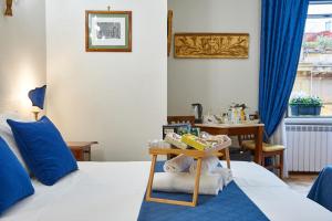 Łóżko lub łóżka w pokoju w obiekcie Fabrizio's Rooms