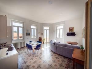 a living room with a couch and a table at VILLA SILVIA-by Home Sitter Como in Como
