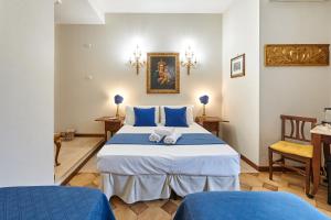 Łóżko lub łóżka w pokoju w obiekcie Fabrizio's Rooms