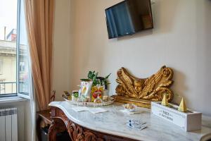 Telewizja i/lub zestaw kina domowego w obiekcie Fabrizio's Rooms