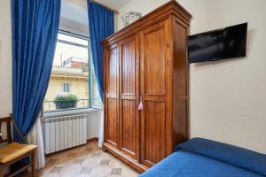 Telewizja i/lub zestaw kina domowego w obiekcie Fabrizio's Rooms