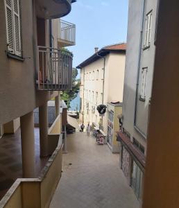 an alley with buildings and people walking down a street at BP APARTMAN in Poreč