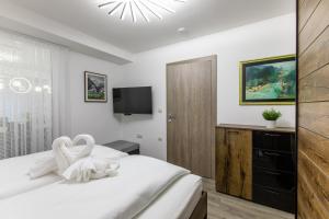Postel nebo postele na pokoji v ubytování Reset Apartments