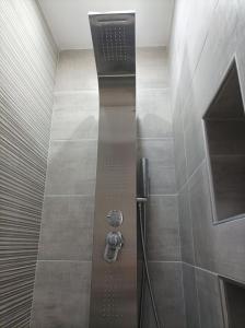 a shower with a glass door in a bathroom at Annas House Theologos in Theologos