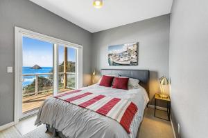 Postel nebo postele na pokoji v ubytování Oceanside Oasis