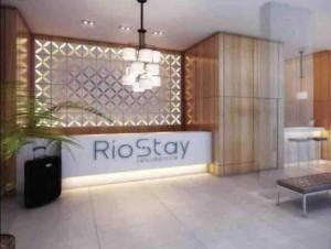 a room with a ricostay sign on the wall at RIO STAY RESIDENCE in Rio de Janeiro +12 photos