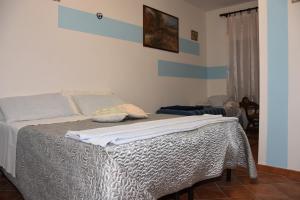 Posteľ alebo postele v izbe v ubytovaní Agriturismo Maria Cristina