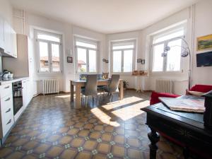 a kitchen and dining room with a table and chairs at VILLA SILVIA-by Home Sitter Como in Como