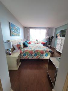 a bedroom with a bed and a window at Oceanfront lux condo in Long Beach +34 photos