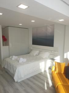 Un pat sau paturi într-o cameră la Estudio Amalfi