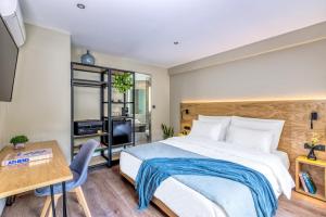 Postel nebo postele na pokoji v ubytování Arcade Hotel Athens
