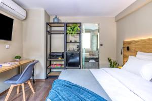 Postel nebo postele na pokoji v ubytování Arcade Hotel Athens