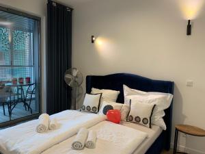 Posteľ alebo postele v izbe v ubytovaní Baltic Riviera Apartments - Granaria Riverside