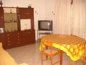 En tv och/eller ett underhållningssystem på Calatafimi Segesta Apartment