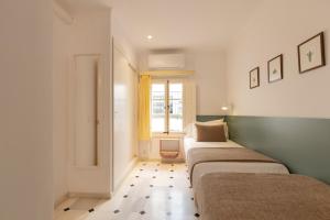 Posteľ alebo postele v izbe v ubytovaní Villa Ca na Tonina - La Goleta Hotel de Mar & Villas