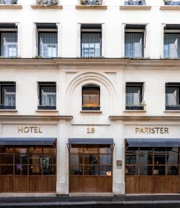 a large building with a large window on the side of the building at Hotel Parister in Paris