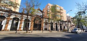 a white car is parked in front of a building at El Arroyo in Seville