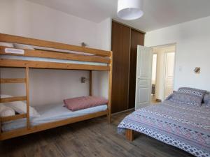 a bedroom with two bunk beds and a bed at Appartement Valloire, 3 pièces, 8 personnes - FR-1-263-82 in Valloire