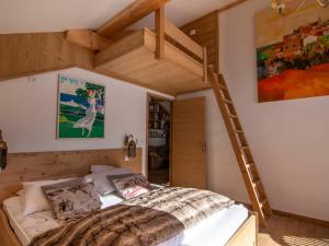 a bedroom with a loft bed and a ladder at Chalet Valloire, 5 pièces, 12 personnes - FR-1-263-498 in Valloire