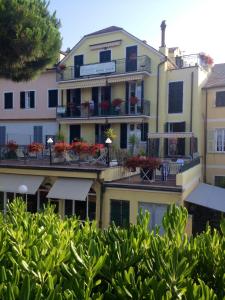 an apartment building with flowers on the balconies at Giada in Moneglia