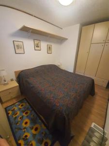 A bed or beds in a room at Apartment San Giacomo - Brentonico