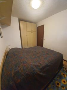 A bed or beds in a room at Apartment San Giacomo - Brentonico