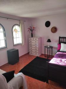 a bedroom with a bed and a dresser at Fazenda do Marante in Tomar +52 photos