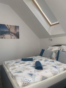 a bedroom with a bed in a room with a ceiling at Villa Corner in Tihany