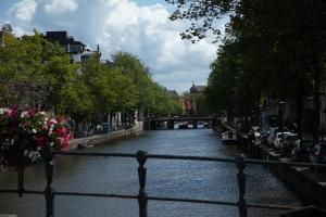 a river with a bridge in a city at Hotel 717 in Amsterdam