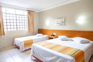 Postel nebo postele na pokoji v ubytování Vila Verde Hotel