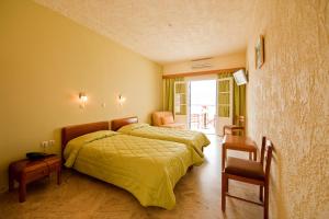 Кровать или кровати в номере Hotel Philoxenia