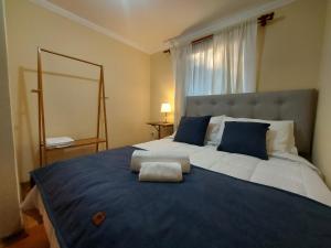 Ένα ή περισσότερα κρεβάτια σε δωμάτιο στο Hostal Casa Encino