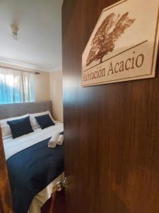 Кровать или кровати в номере Hostal Casa Encino