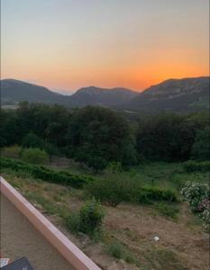 a view of a sunset from the balcony of a house at Casa Julie in Patrimonio