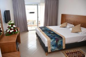 Postel nebo postele na pokoji v ubytování Hotel Residence Imiplage