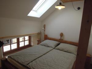 Postel nebo postele na pokoji v ubytování Apartmány Kamenka