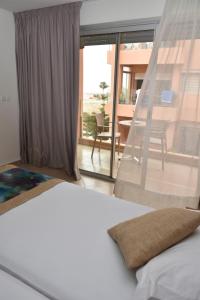 Postel nebo postele na pokoji v ubytování Hotel Residence Imiplage