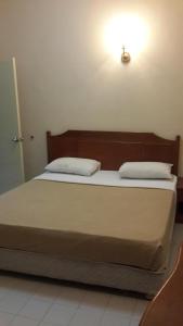 Säng eller sängar i ett rum på Golden City Apartment - Leisure Holiday Resorts