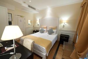 Posteľ alebo postele v izbe v ubytovaní Hotel Bologna ***S