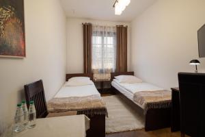 Posteľ alebo postele v izbe v ubytovaní Hotel Beskid